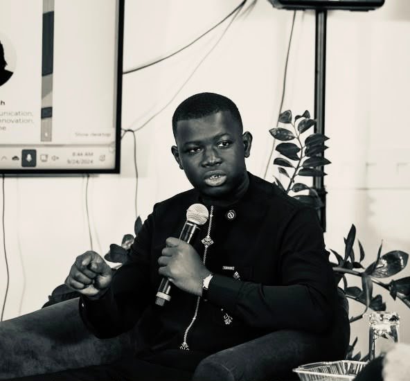 Ousman Touray speaking at a convening